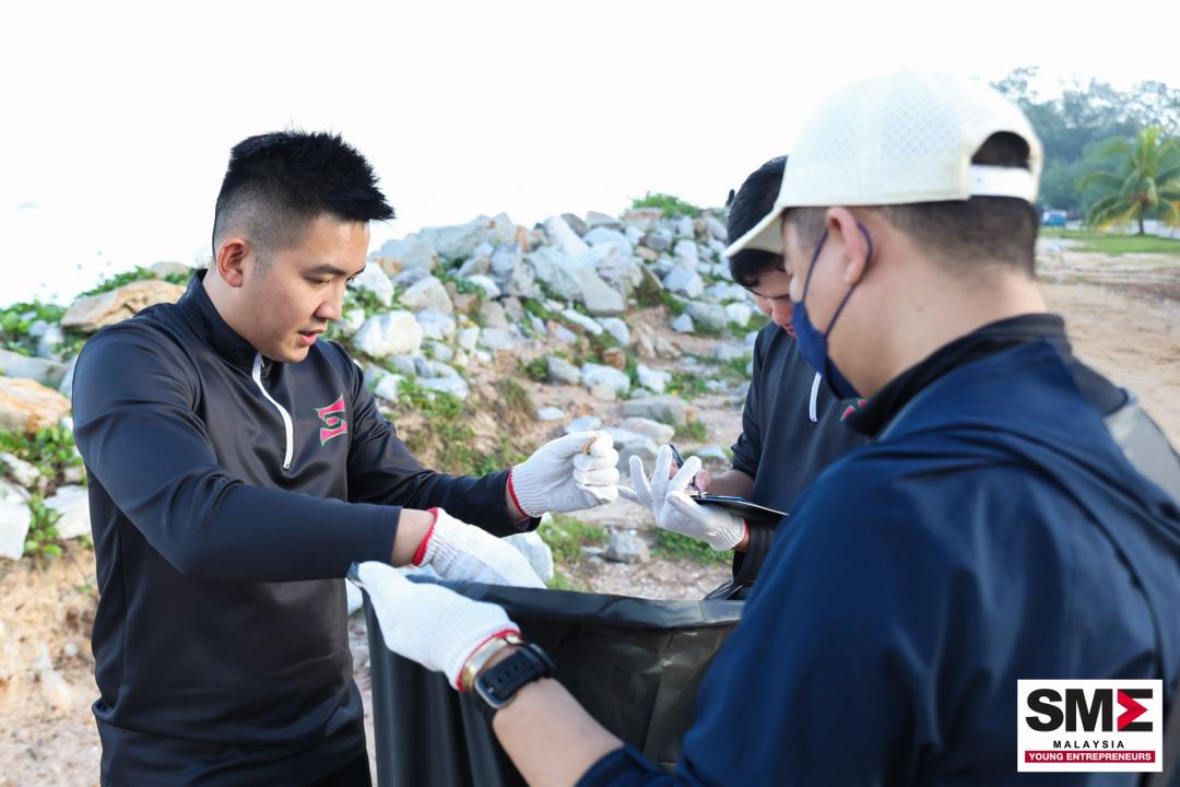 Team SCE clearing litter along a rocky shoreline